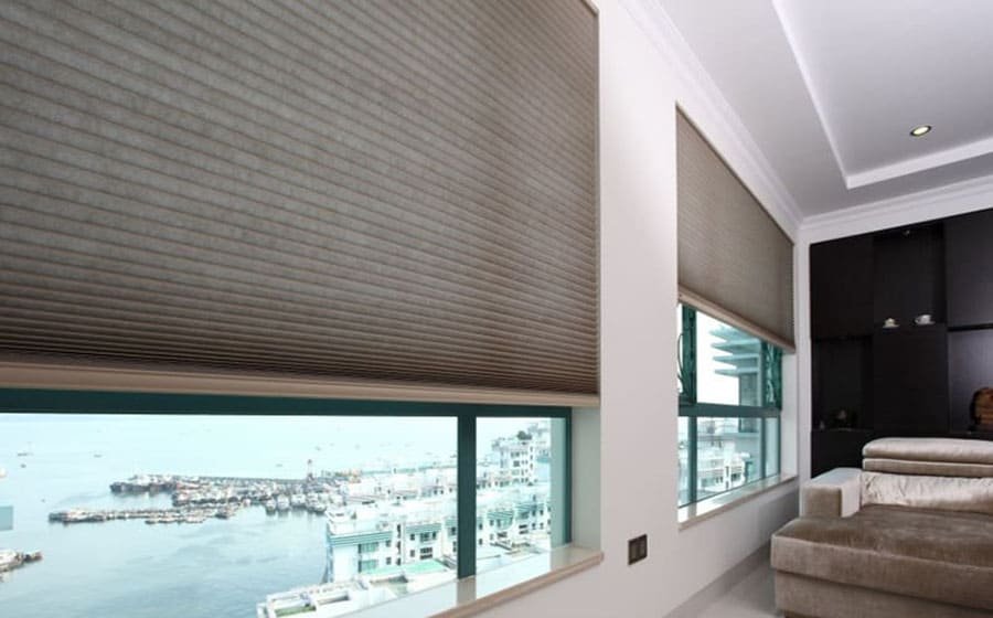 Cellular shades and sheer vertical blinds in modern interior